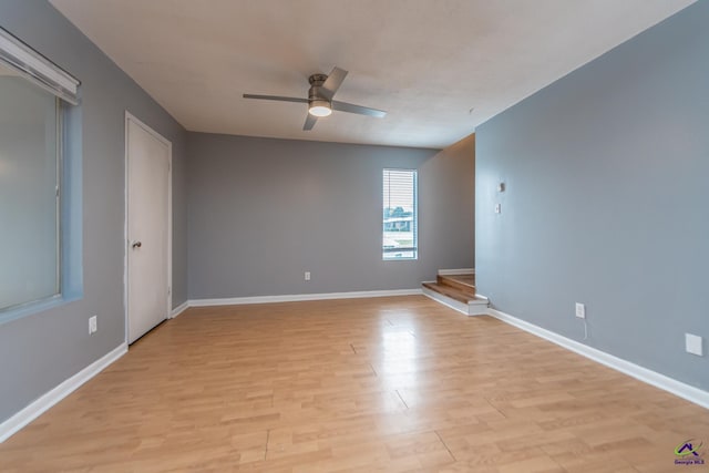 unfurnished room with ceiling fan and light hardwood / wood-style floors