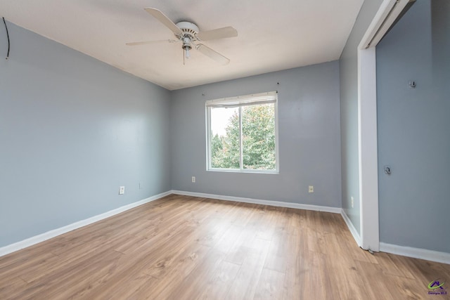 empty room with ceiling fan and light wood-type flooring