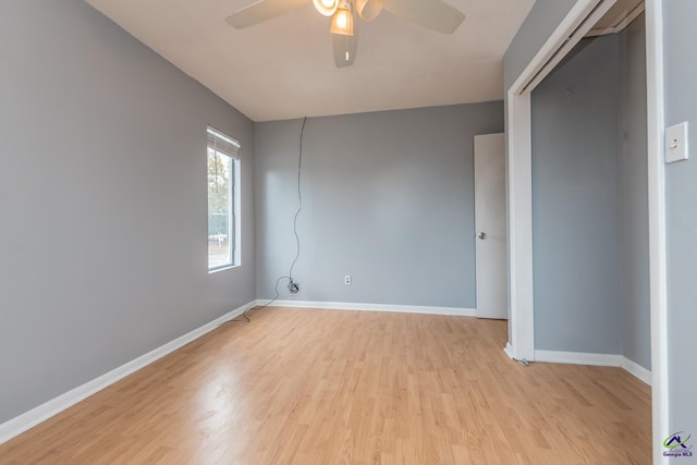 empty room with ceiling fan and light wood-type flooring