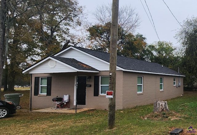 bungalow with a patio and a front yard