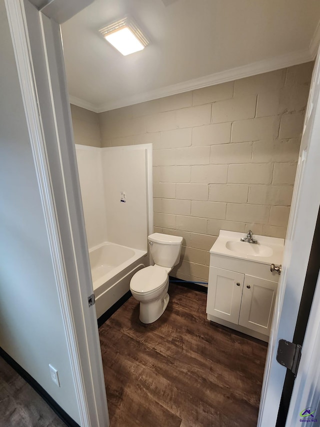 bathroom with crown molding, hardwood / wood-style floors, vanity, and toilet