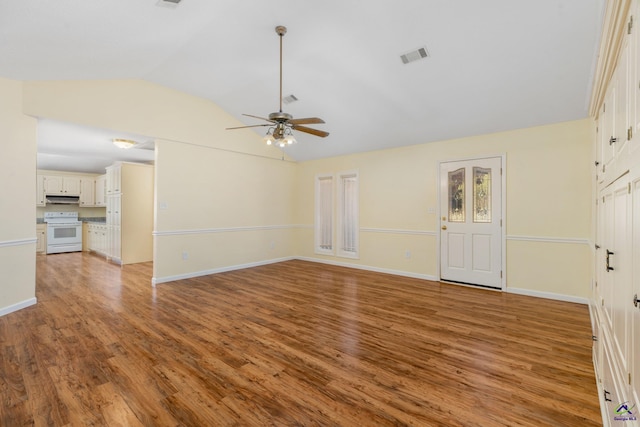 unfurnished living room with ceiling fan, light hardwood / wood-style floors, and vaulted ceiling