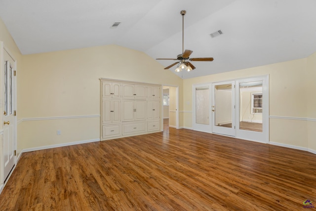 unfurnished bedroom with ceiling fan, lofted ceiling, and light hardwood / wood-style flooring