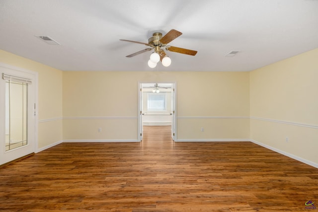 empty room featuring wood-type flooring and ceiling fan