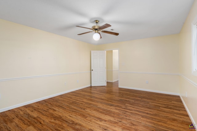 spare room with ceiling fan and wood-type flooring