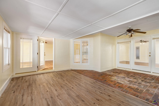 unfurnished room featuring ceiling fan and hardwood / wood-style flooring