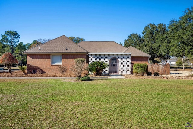 ranch-style house with a front yard