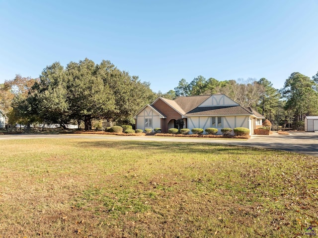 view of front facade with a front lawn and a garage