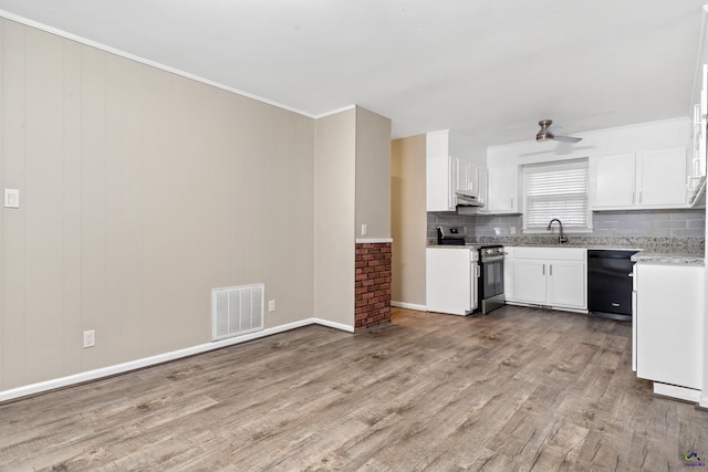 kitchen with stainless steel range with electric stovetop, sink, light hardwood / wood-style flooring, black dishwasher, and white cabinetry