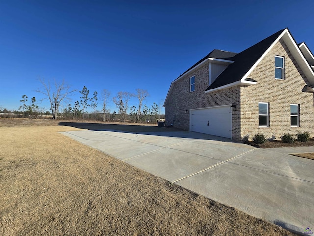 view of side of home with a garage