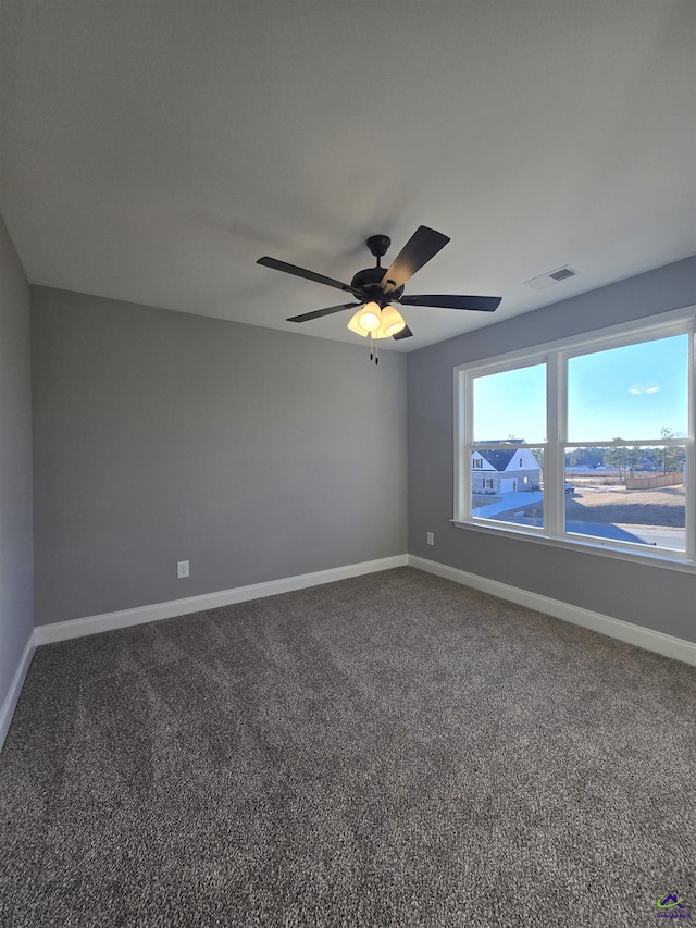 empty room featuring ceiling fan and carpet floors