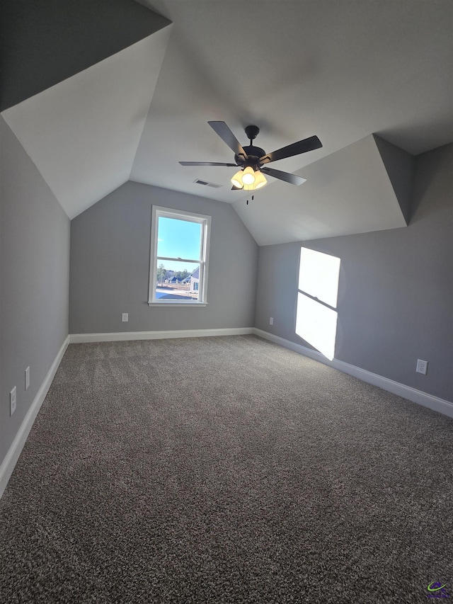 additional living space with carpet flooring, ceiling fan, and lofted ceiling