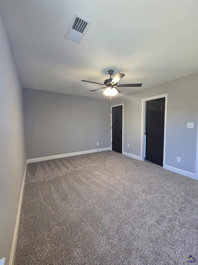 carpeted empty room with ceiling fan