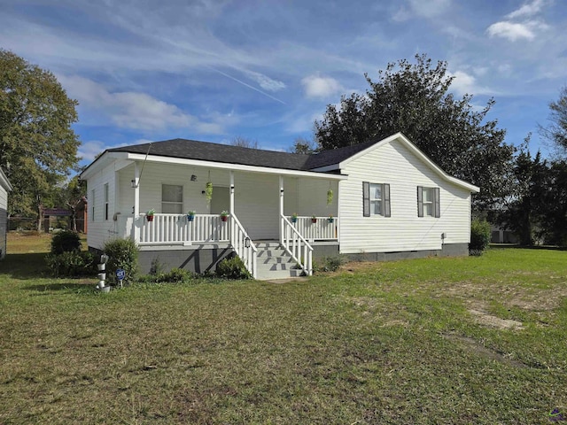 view of front of home with covered porch and a front yard