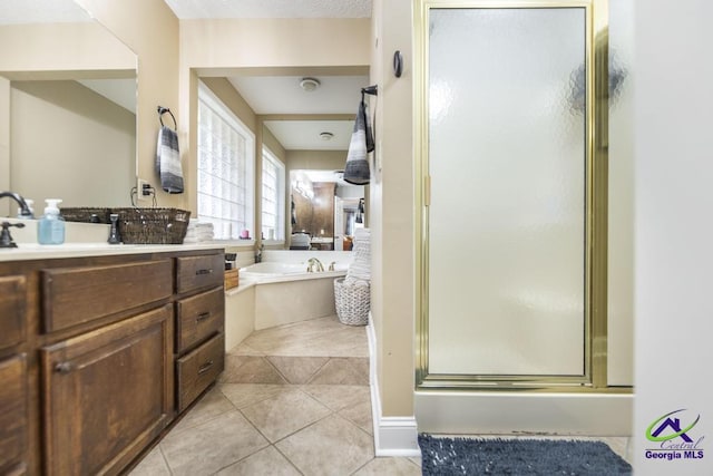 bathroom with tile patterned floors, vanity, and plus walk in shower