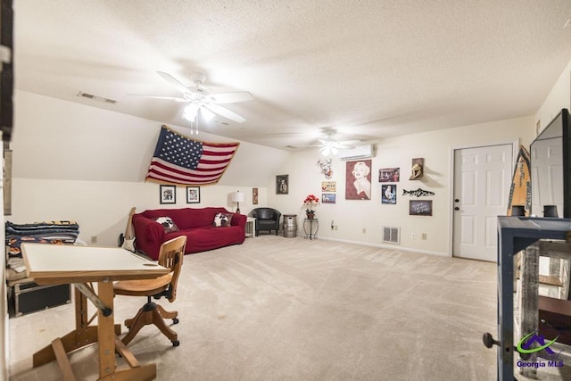 office space featuring light carpet, a textured ceiling, vaulted ceiling, a wall mounted AC, and ceiling fan