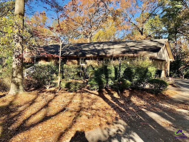 view of side of property featuring a garage