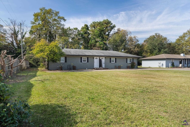 ranch-style home with a front yard