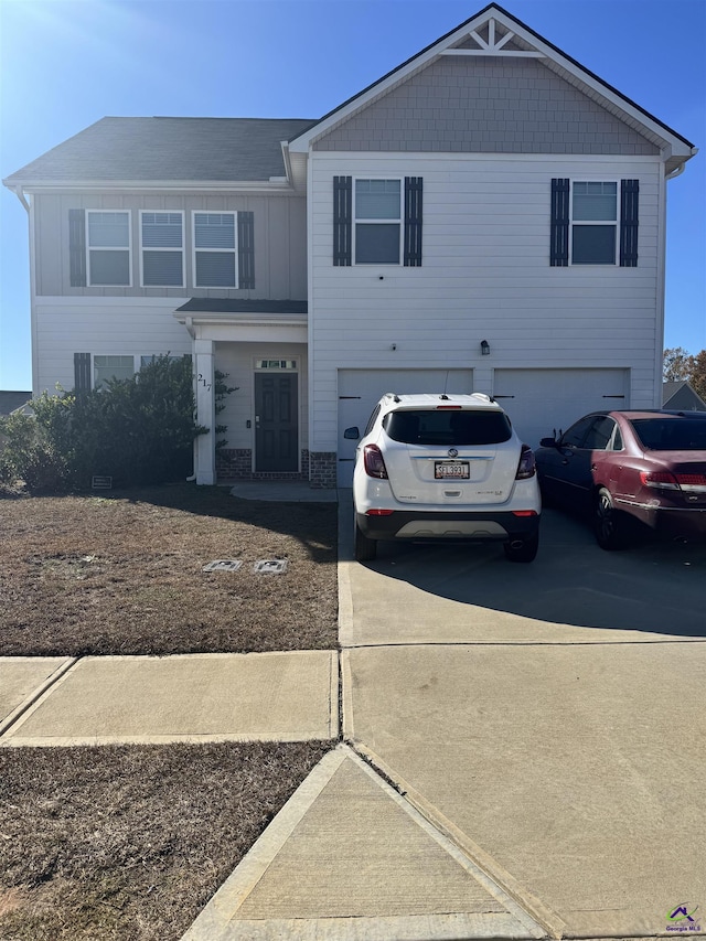 front of property with a garage