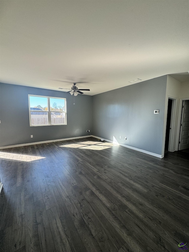 unfurnished room featuring ceiling fan and dark hardwood / wood-style floors