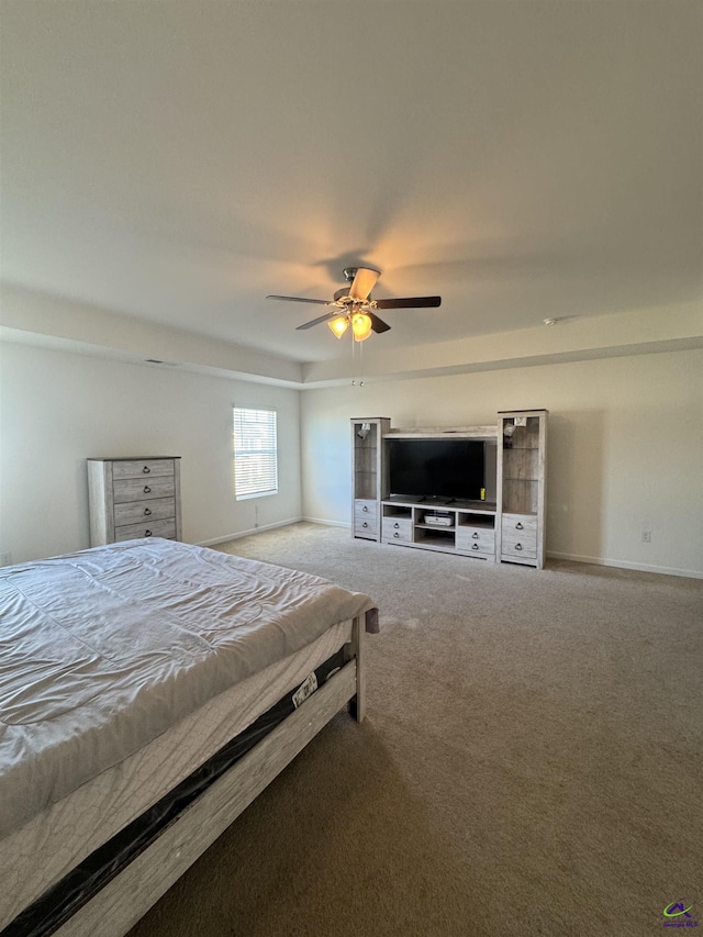 bedroom featuring ceiling fan and carpet