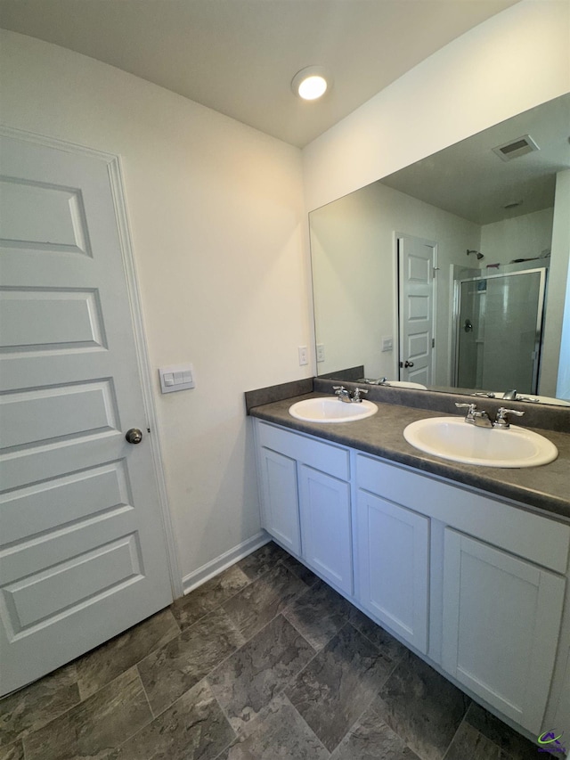 bathroom featuring vanity and walk in shower