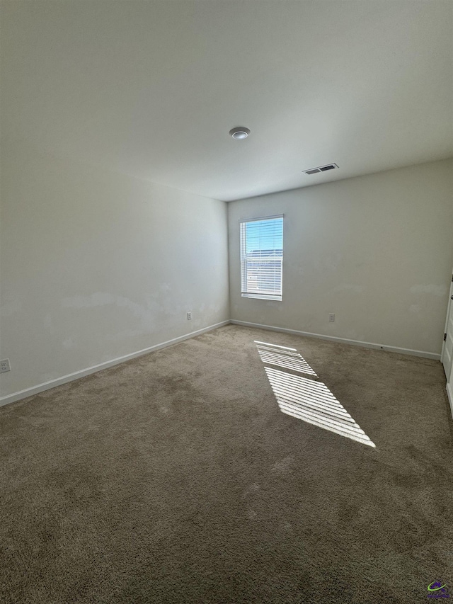 empty room featuring carpet flooring