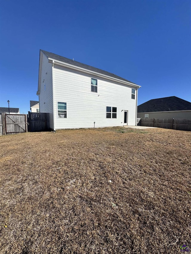 back of property with a patio