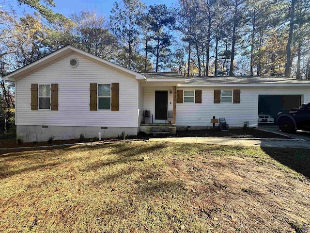 single story home featuring a front yard and a garage