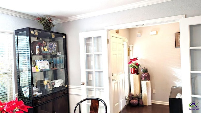 interior space featuring crown molding and wood-type flooring