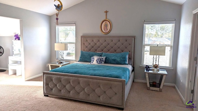 carpeted bedroom featuring multiple windows and lofted ceiling