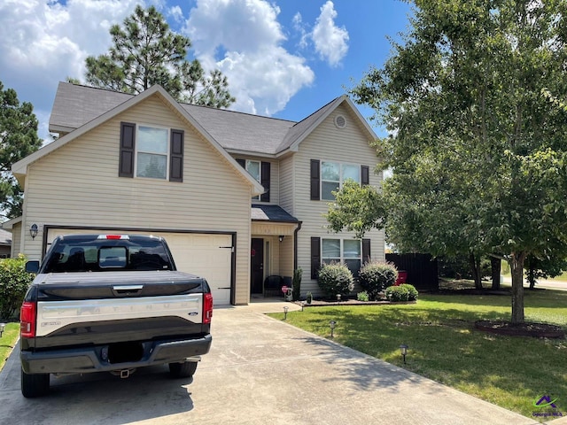 view of front property with a garage and a front yard