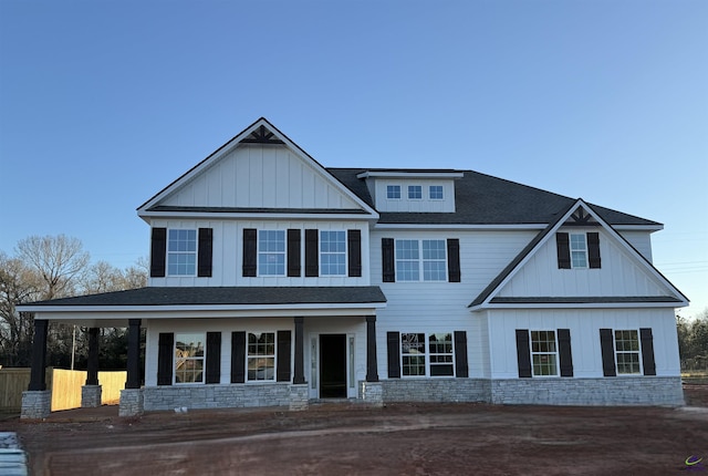 view of front of house featuring roof with shingles and board and batten siding