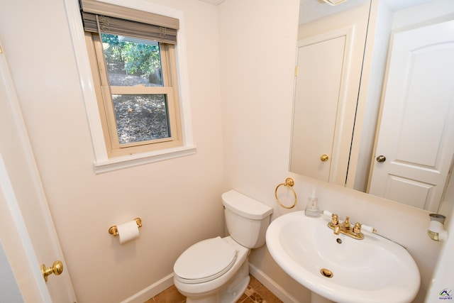 bathroom with toilet and sink