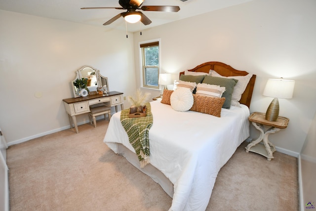 bedroom featuring ceiling fan and light carpet