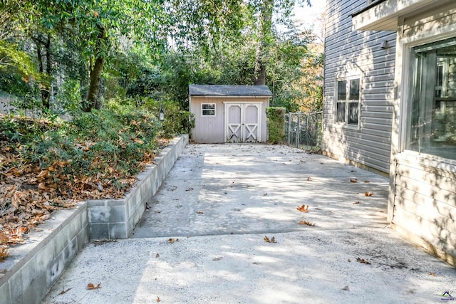 view of patio with a shed