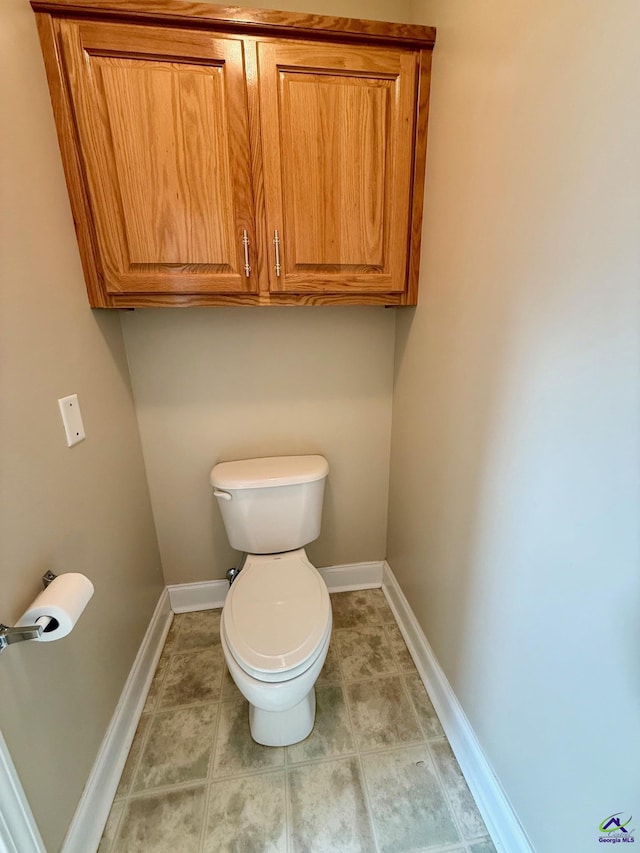 bathroom featuring tile patterned floors and toilet