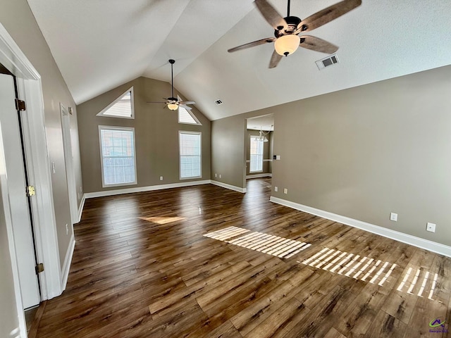 unfurnished living room featuring dark hardwood / wood-style floors, ceiling fan, and lofted ceiling