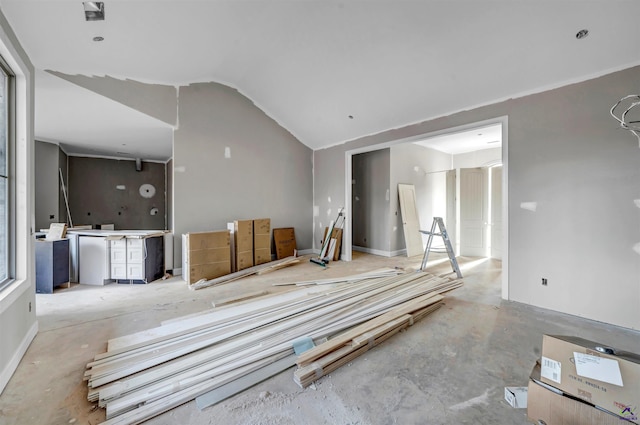 spare room with vaulted ceiling