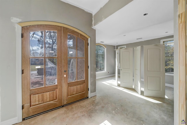 entryway with a wealth of natural light and french doors