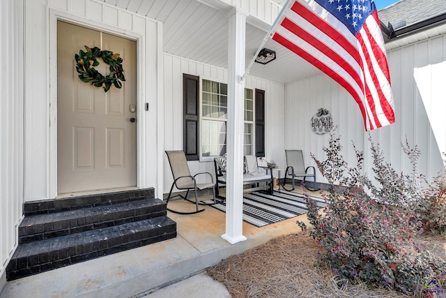 property entrance with covered porch