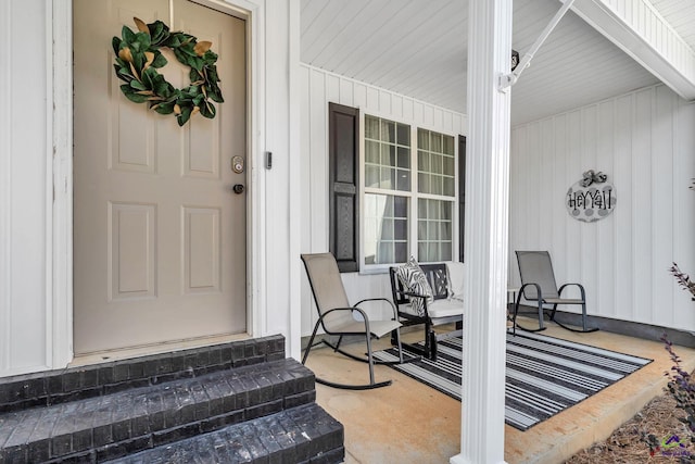 doorway to property with a porch