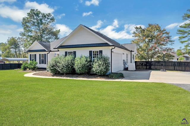 view of front of home with a garage and a front yard