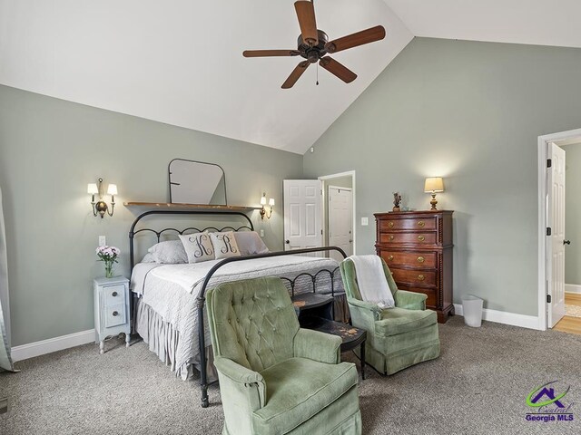 bedroom with carpet flooring, ceiling fan, and high vaulted ceiling