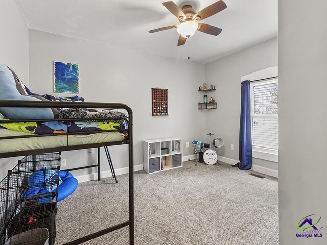 carpeted bedroom with ceiling fan