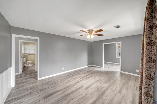 spare room featuring ceiling fan and light hardwood / wood-style flooring