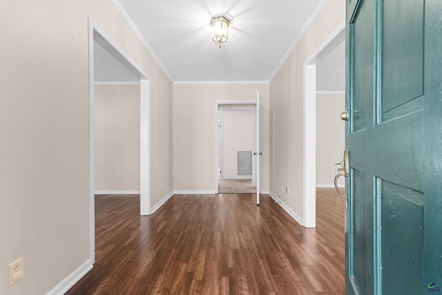 entrance foyer with dark hardwood / wood-style flooring and crown molding