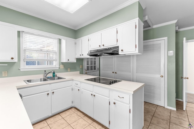 kitchen featuring black electric stovetop, crown molding, white cabinets, and sink