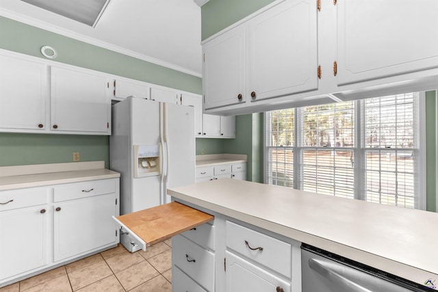 kitchen featuring white cabinets, plenty of natural light, white fridge with ice dispenser, and crown molding