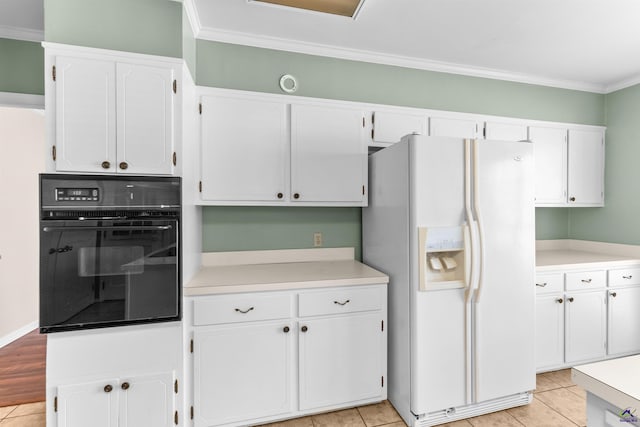 kitchen with black oven, white cabinetry, white fridge with ice dispenser, and crown molding